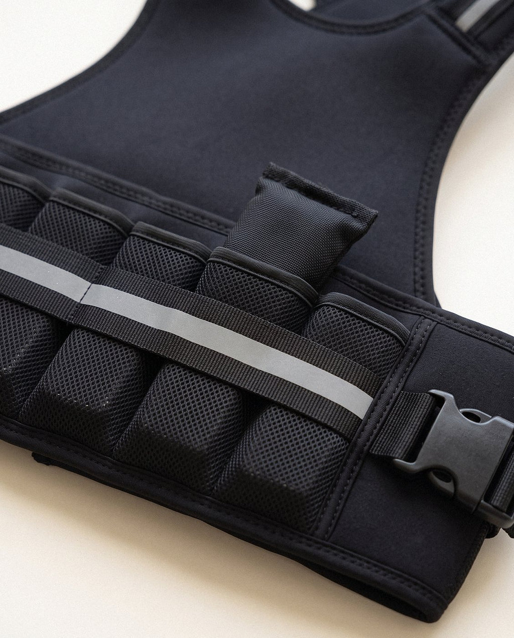 Macro of a sealed iron weight pack and double-stitched pocket